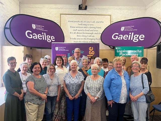 Chair of Fermanagh and Omagh District Council with artist and participants of the project